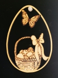 Osterdekoration: Osterei, Osterkorb & Schmetterling